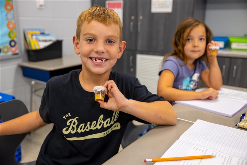 Students smile in science class